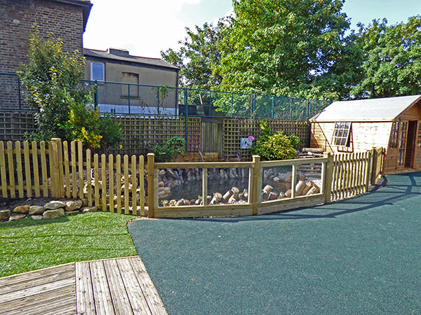 Nature observation pond with wooden safety fencing