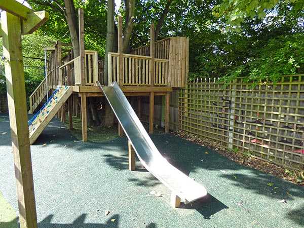 Refurbished raised deck and repurposed stainless steel slide