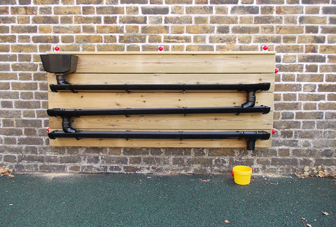 Water play system with bucket and drainpipes