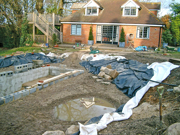 preparing the deep section of swimming pond